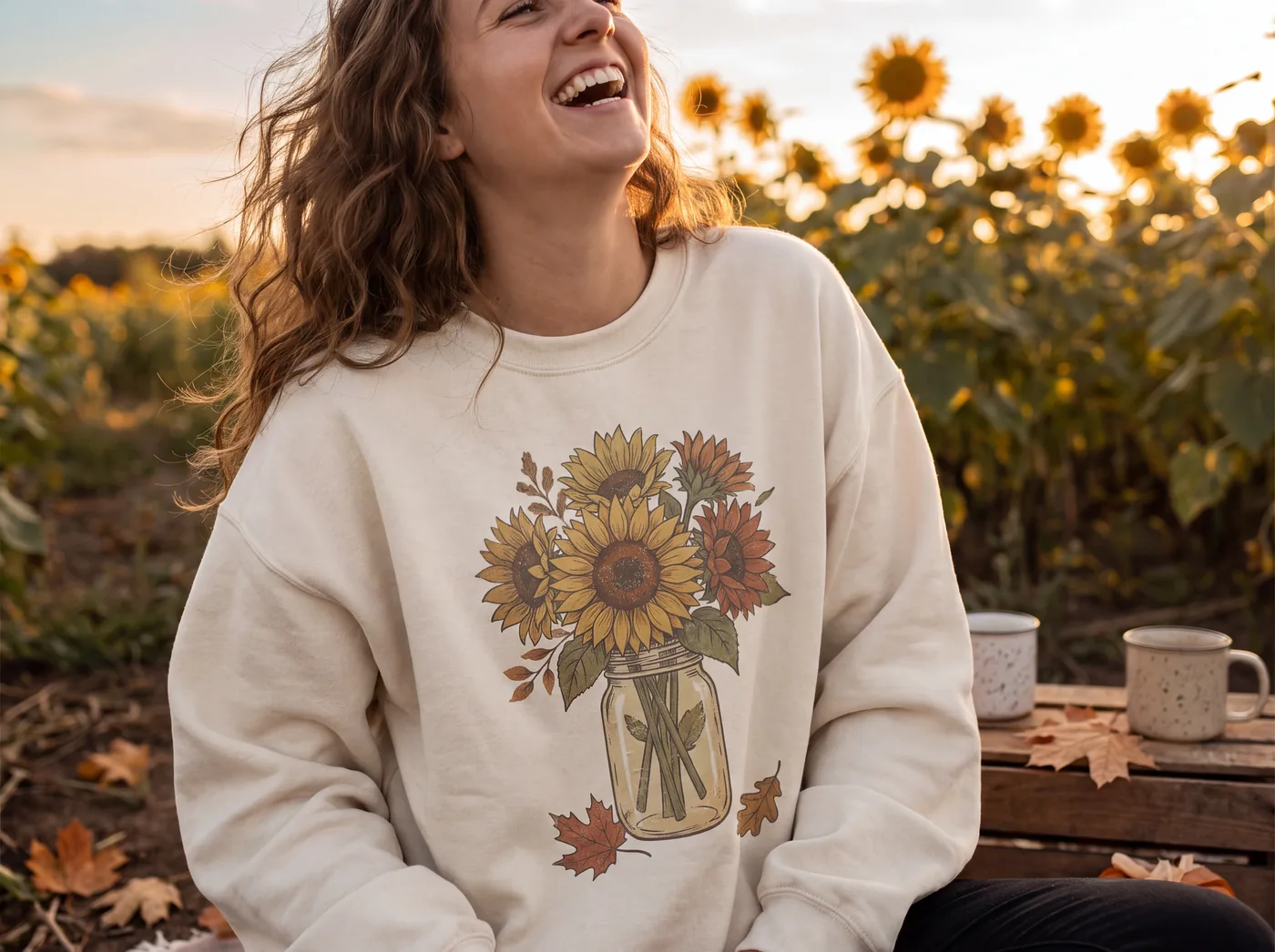 A woman laughing in a sunflower field, wearing a cream sweatshirt printed with a sunflower bouquet, made with Nano Banana