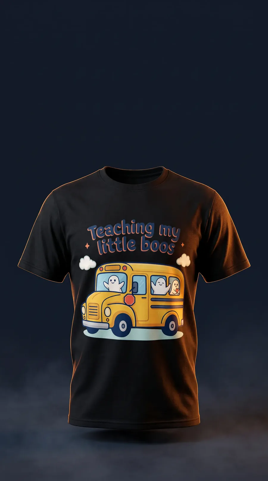 A T-shirt reading 'Teaching my little boos', with ghosts in a school bus